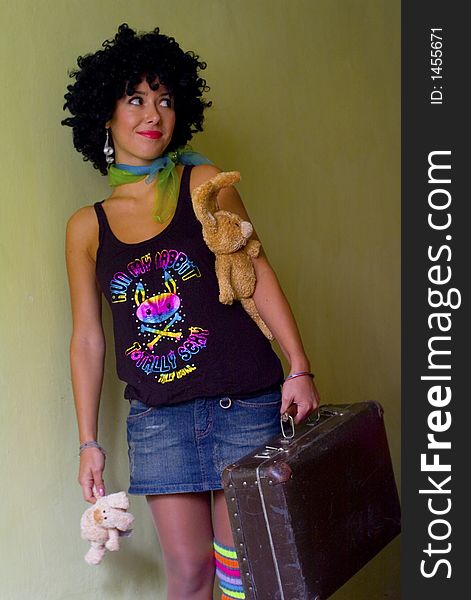 Cute curly disco girl with rabbits and suitecase going to travel