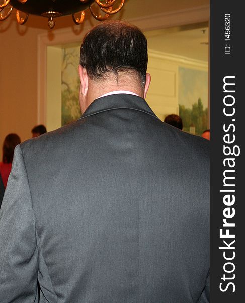 The back of a business man.