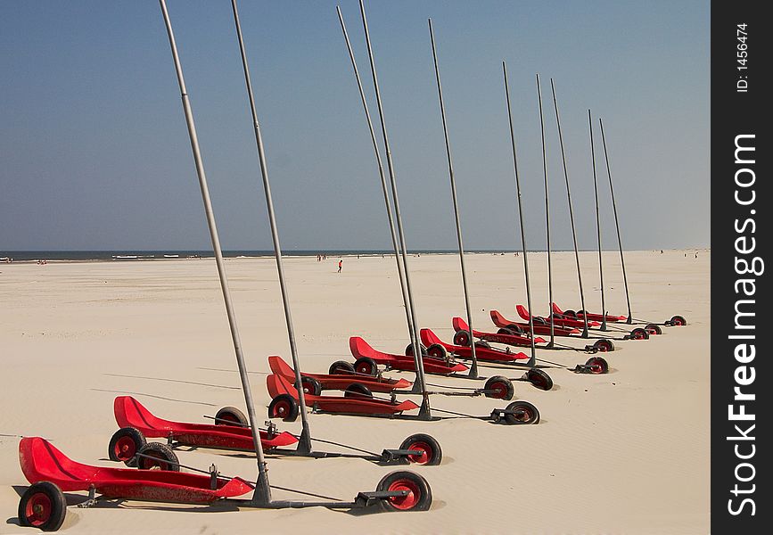 Red beach sail-carts waiting in line. Red beach sail-carts waiting in line