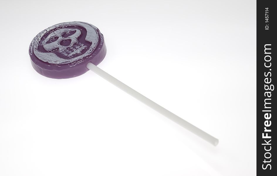 Photo of a Grape Lollipop With a Skull Image