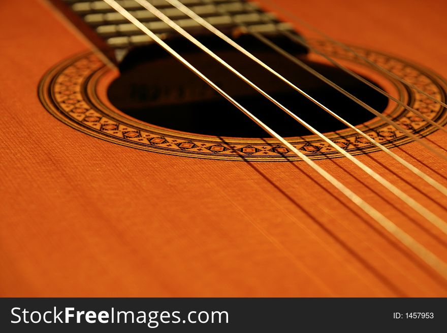 Closeup of classical guitar laying down