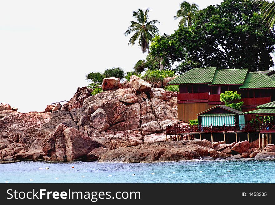 A small wooden resort build on natural coastal rocks. A small wooden resort build on natural coastal rocks