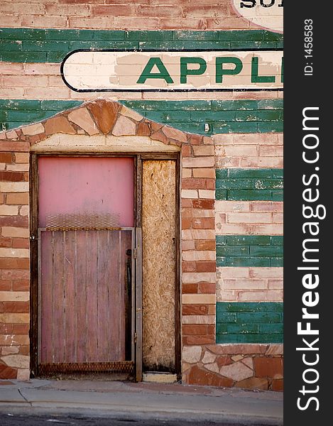 Wall and door to an abandoned appliance store. Wall and door to an abandoned appliance store