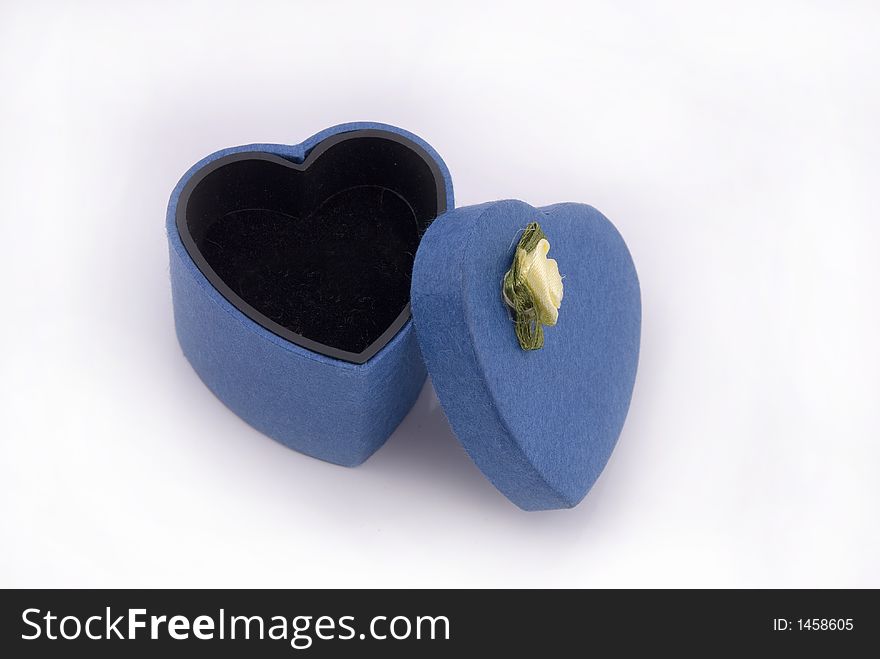 A blue heart shape gift box with yellow rose