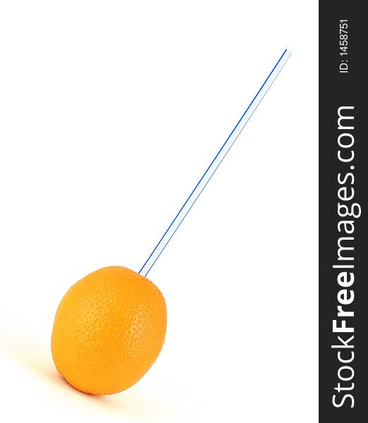 Drinking juice with a straw out of the whole orange. Drinking juice with a straw out of the whole orange