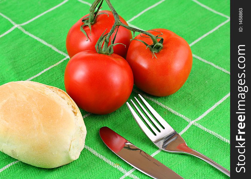 Red Tomatoes On Green Cloth