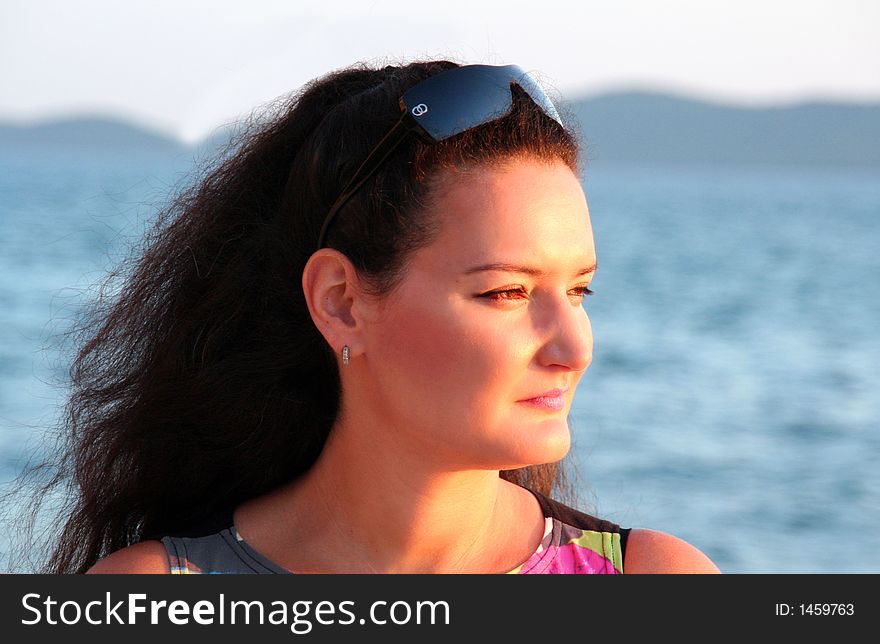 Woman enjoying sunset on vacation