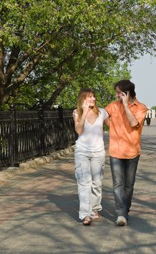 Girl And Boy Talking On The Phone Royalty Free Stock Photography