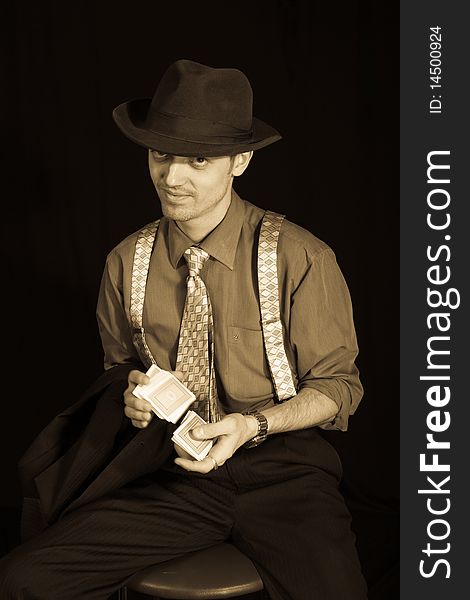 Old style photo of man playing card game. Old style photo of man playing card game