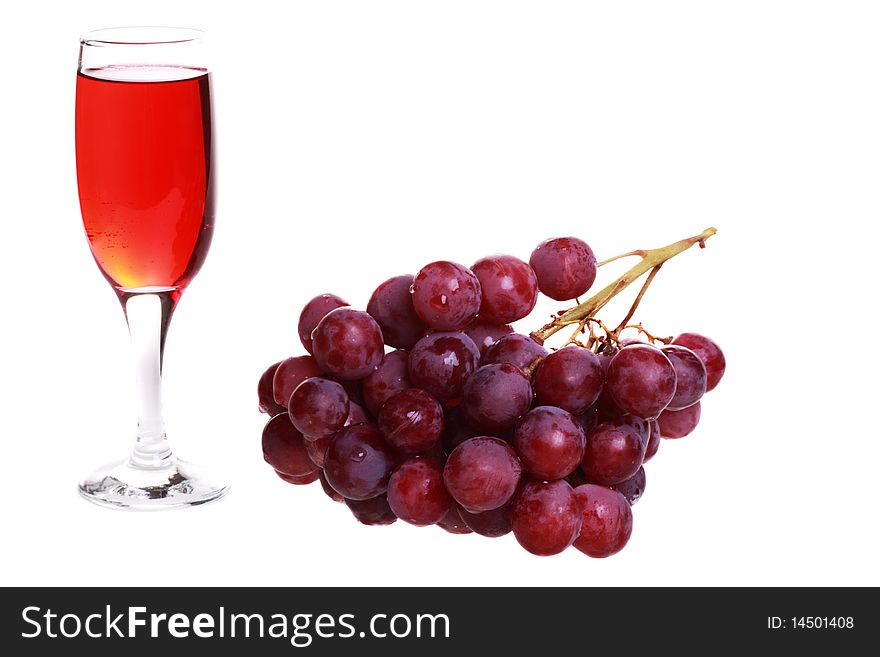 A Glass And A Bunch Of Grapes.