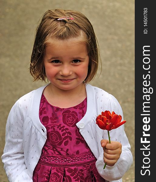 Sweet smiling girl with garden tulip. Sweet smiling girl with garden tulip