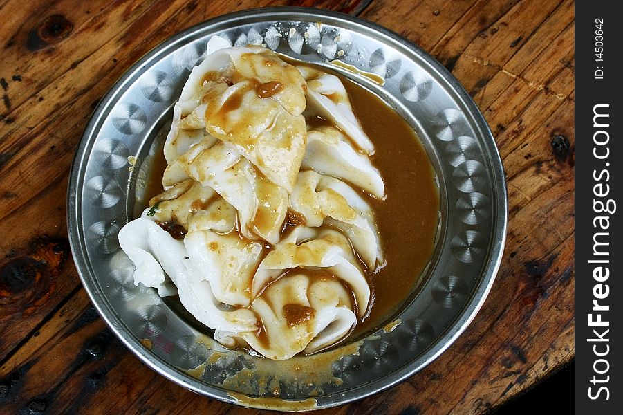 The dumpling in china,on dish with gravy...