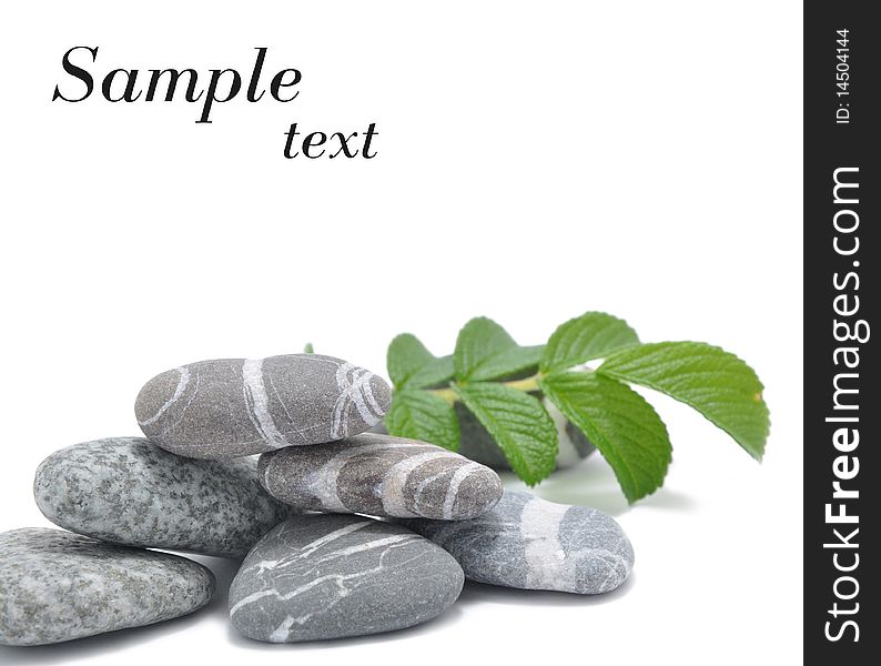 Picture of different smooth stone on a white background with a mestome for inscription
