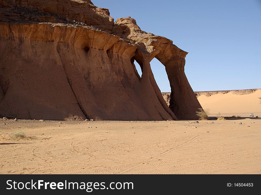 A cliff in the desert of Libya, in Africa. A cliff in the desert of Libya, in Africa