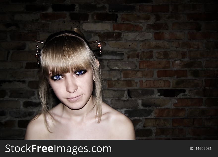 the girl, blue eyes, the big eyes, gold earrings, a wall, a background, naked open naked shoulders, looks in the chamber, a close up, serious, the pinned up hair, a hairdress, dark shades. the girl, blue eyes, the big eyes, gold earrings, a wall, a background, naked open naked shoulders, looks in the chamber, a close up, serious, the pinned up hair, a hairdress, dark shades