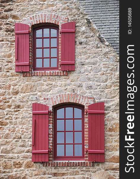 Red windows with shutter in britany france