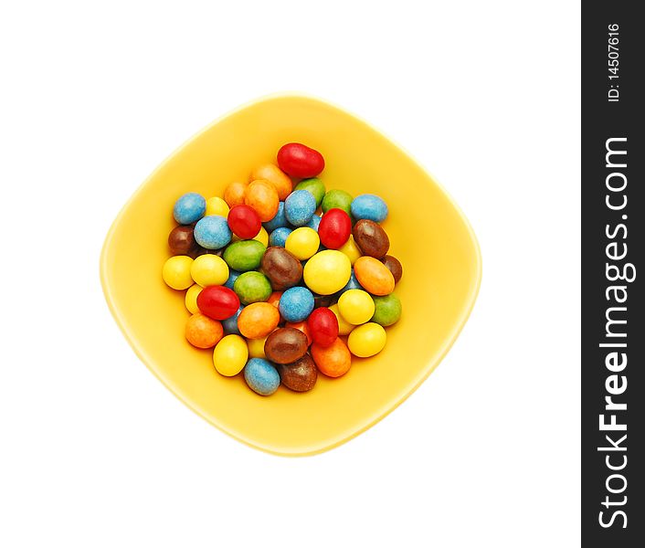 Candy in a bowl isolated on white