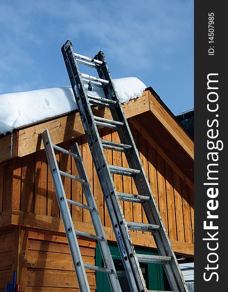 Ladders on a snowy roof in colorado