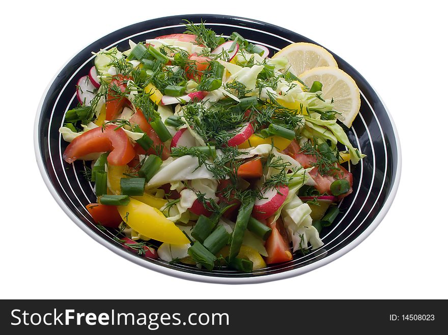 Salad on the black plate.
White background. Salad on the black plate.
White background.