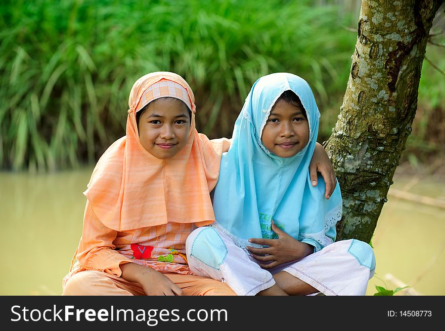 Outdoor portrait of happy Muslim girls. Outdoor portrait of happy Muslim girls
