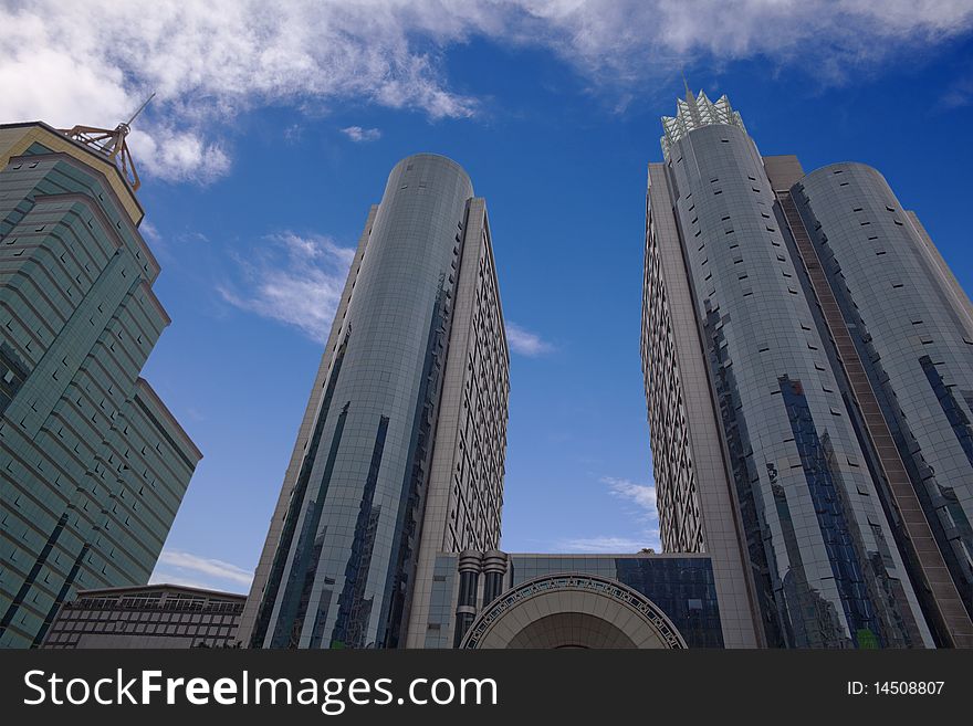 The modern office buildings on blue sky background