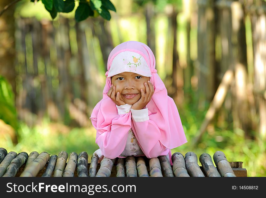 Outdoor portrait  of Indonesian happy Muslim girl