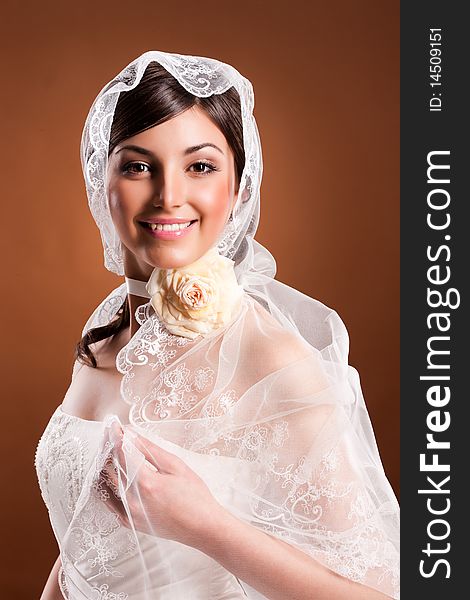Young woman in a wedding dress and bridal. Young woman in a wedding dress and bridal