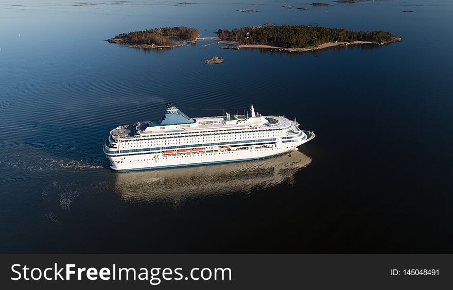 Aerial view of cruise liner sailing in the open sea