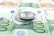 Currency And Compass Stock Photo Currency And Compass Stock Photo