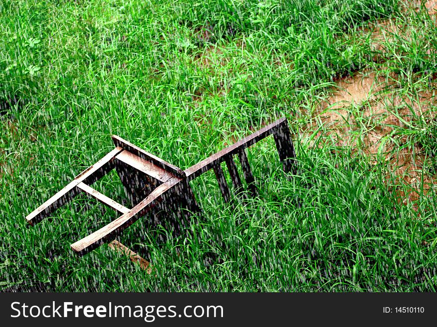 Chair on the ground in rainy day.