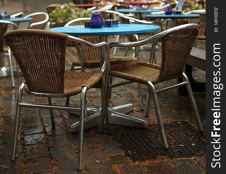 Restaurant in rain two chairs alone