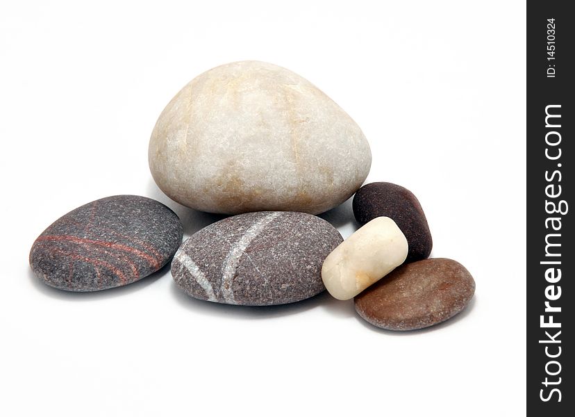 Picture of different smooth stone on a white background