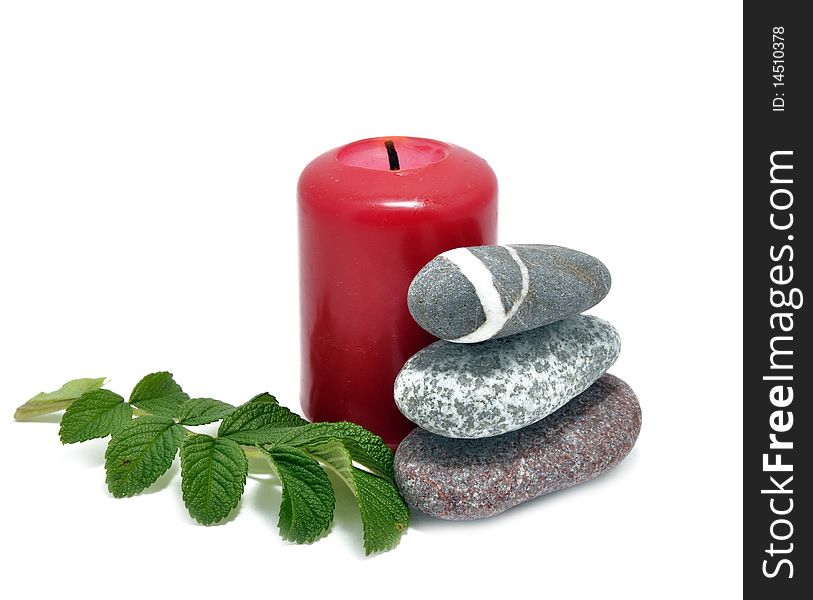 Picture of conflagrant candle and stone on a white background