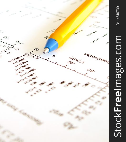 Mathematical graph and pen on a piece of paper. Mathematical graph and pen on a piece of paper