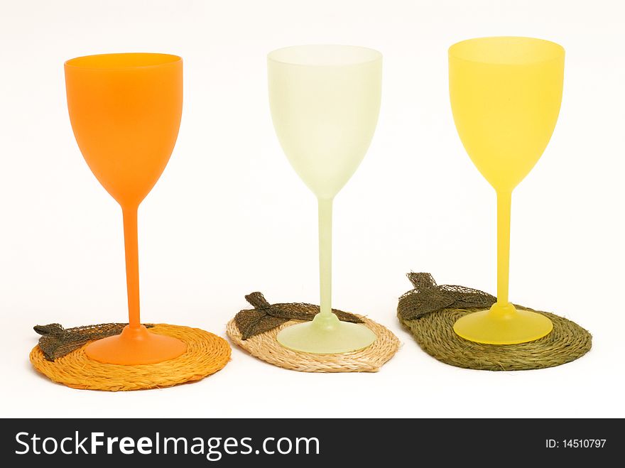 Three glasses colored by cocktail