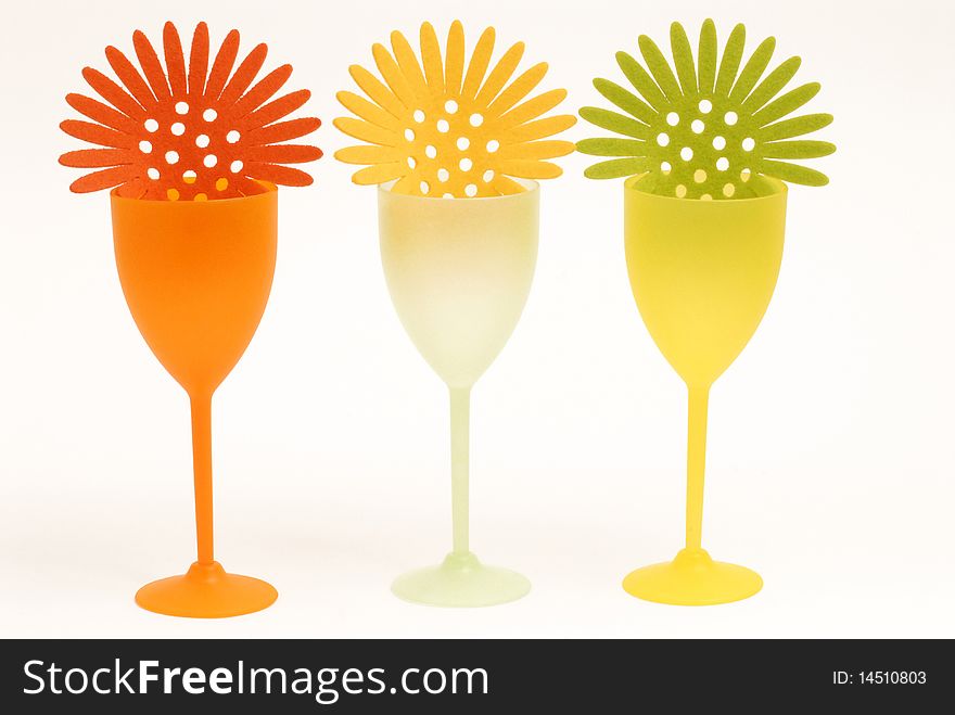 Three glasses colored by cocktail