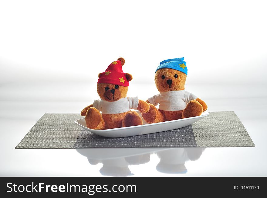 Picture of 2 Teddy bears served on a dish. Picture of 2 Teddy bears served on a dish.