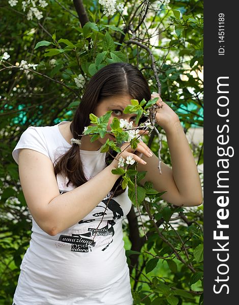 Summer girl against a background of green grass. Summer girl against a background of green grass