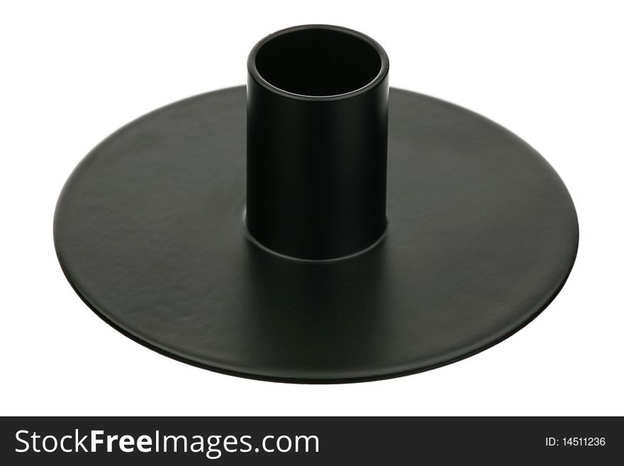 The black metal candlestick is isolated on a white background. The black metal candlestick is isolated on a white background