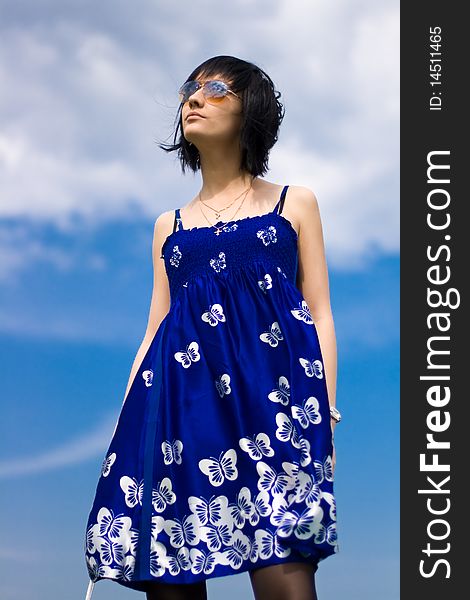 Summer girl against a background of blue sky. Summer girl against a background of blue sky