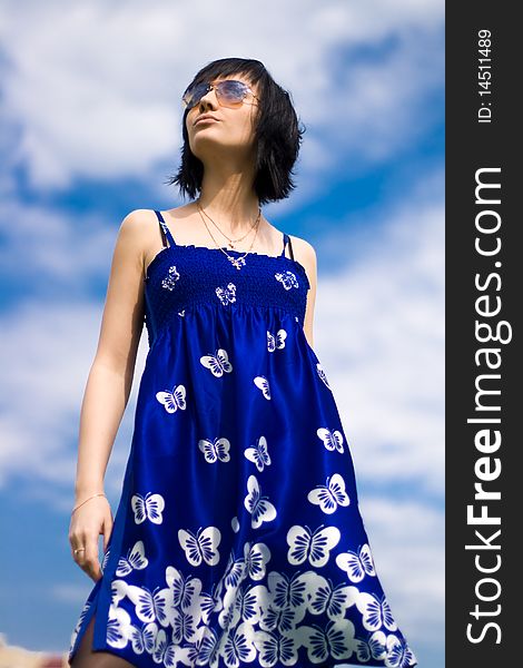 Summer girl against a background of blue sky. Summer girl against a background of blue sky