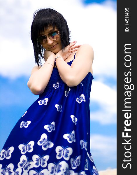 Summer girl against a background of blue sky. Summer girl against a background of blue sky