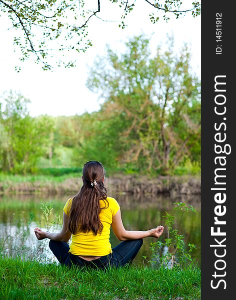 Girl sitting on the river