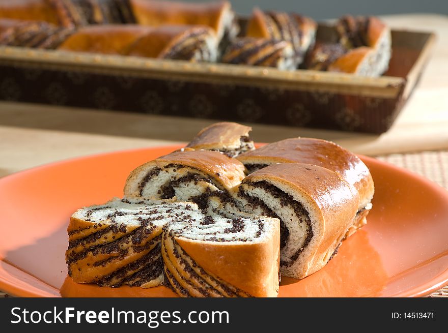 Pieces of sweet pie with poppy seeds on a table