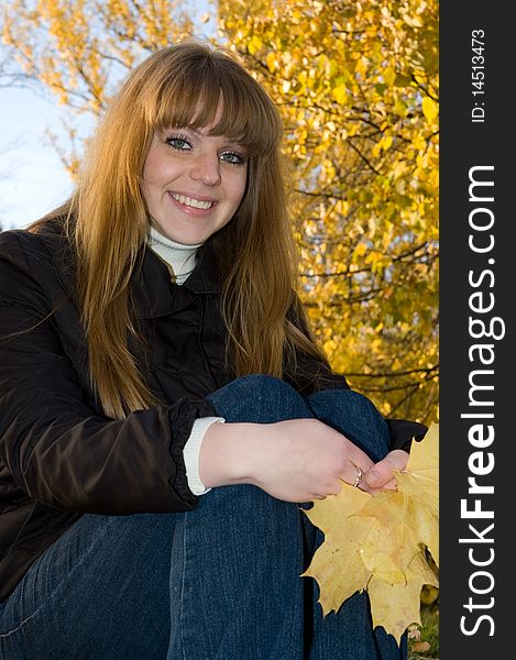 Young girl in autumn park