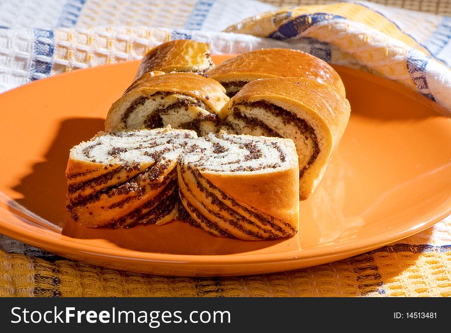 Pieces of sweet pie with poppy seeds on a table