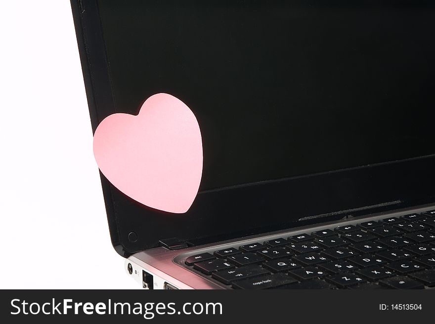 Black laptop screen with pink sticker. Black laptop screen with pink sticker