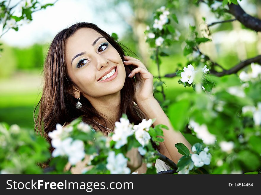 The nice girl in greens of trees