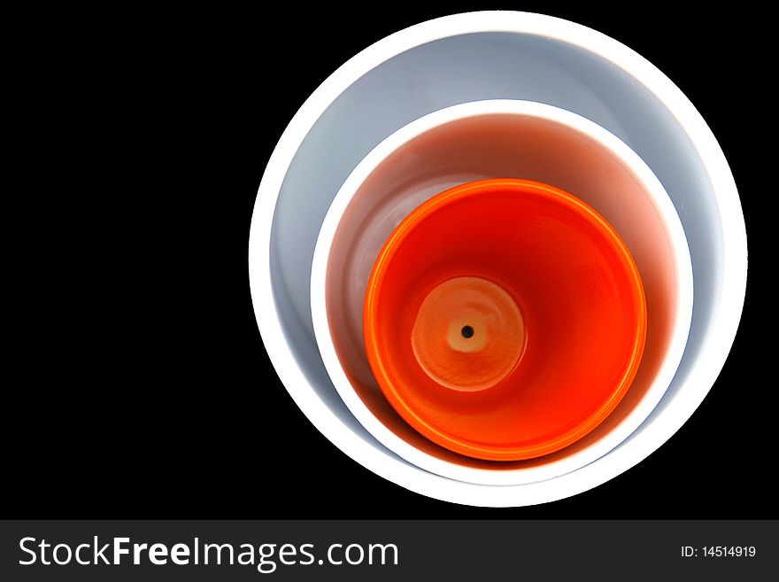 Three flower pots isolated on black background. Three flower pots isolated on black background