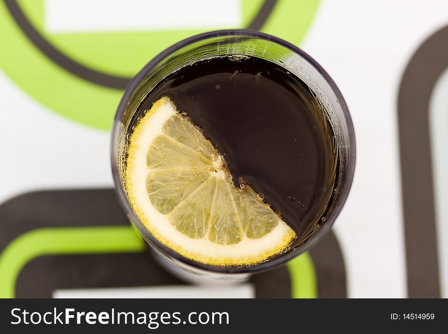 Cola with slice of lemon